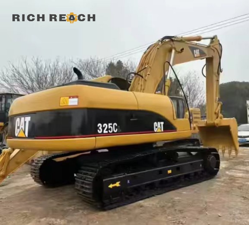 Side profile of a 2021 Cat 325C excavator showing the boom and arm, 500 hours, $30,800